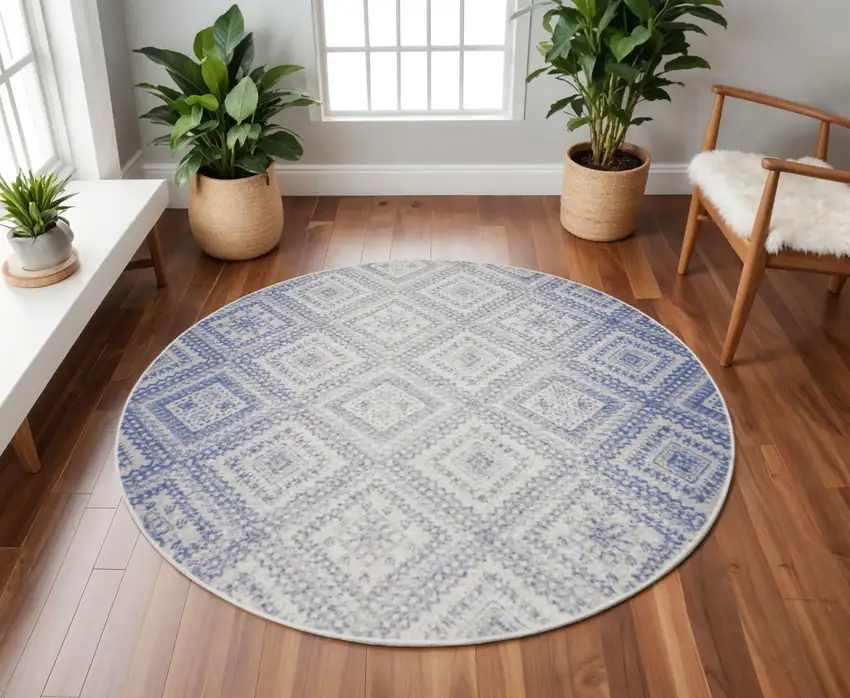 8' Ivory and Blue Geometric Distressed Round Rug Photo 1