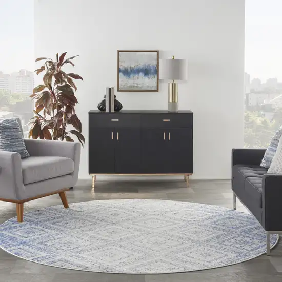 8' Ivory and Blue Geometric Distressed Round Rug Photo 7