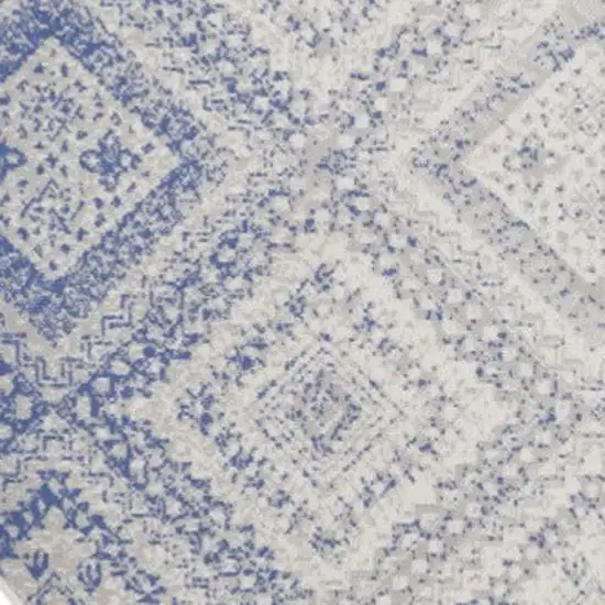 8' Ivory and Blue Geometric Distressed Round Rug Photo 4