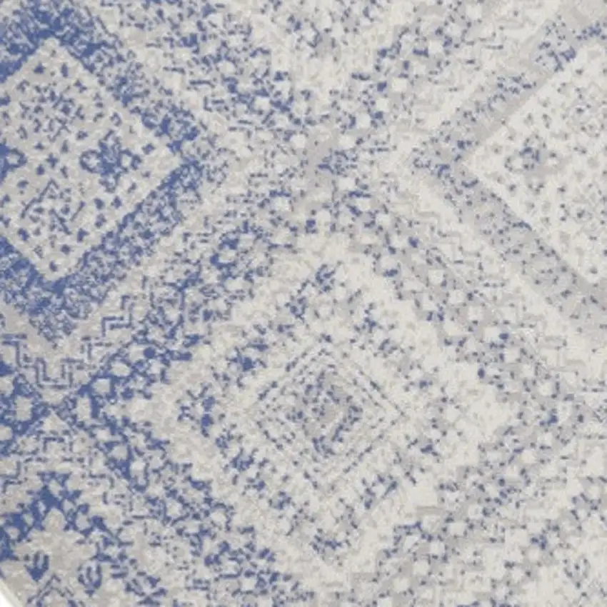 8' Ivory and Blue Geometric Distressed Round Rug Photo 4