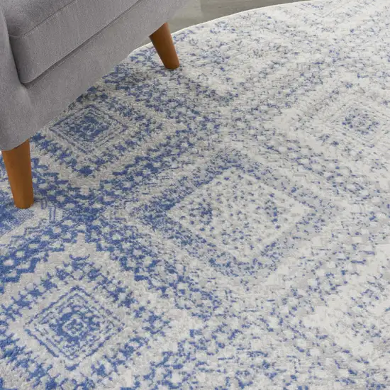 8' Ivory and Blue Geometric Distressed Round Rug Photo 6