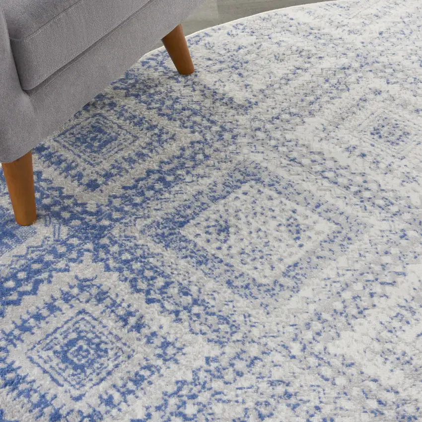 8' Ivory and Blue Geometric Distressed Round Rug Photo 6