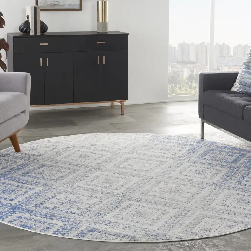 8' Ivory and Blue Geometric Distressed Round Rug Photo 5