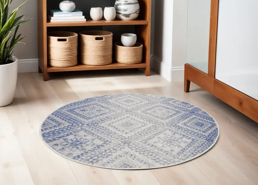 5' Ivory and Blue Geometric Distressed Round Rug Photo 1