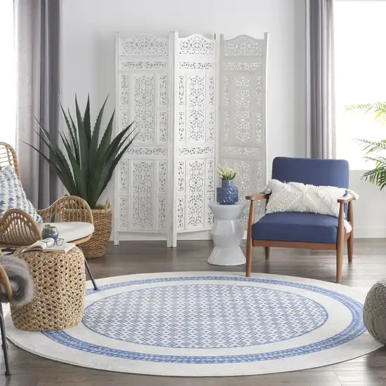 8' Ivory and Blue Geometric Distressed Round Rug Photo 6