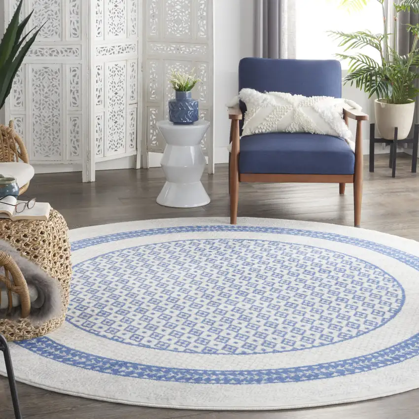 8' Ivory and Blue Geometric Distressed Round Rug Photo 5