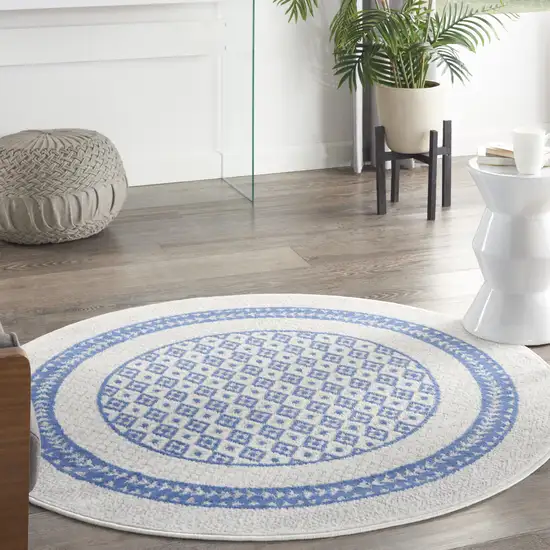 5' Ivory and Blue Geometric Distressed Round Rug Photo 5