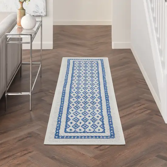 6' Ivory and Blue Geometric Distressed Runner Rug Photo 6