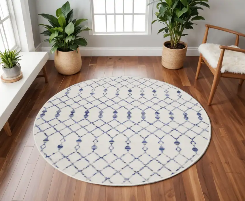 8' Ivory and Blue Geometric Round Rug Photo 1