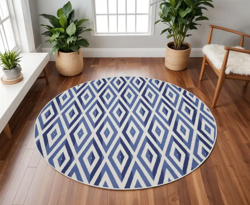 8' Ivory and Blue Geometric Round Rug Photo 1