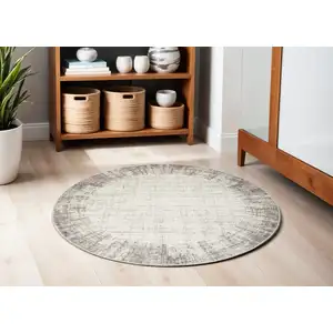 Photo of 5' Ivory and Gray Abstract Round Rug