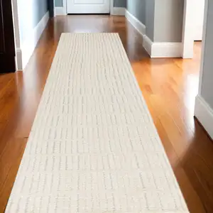 Photo of 10' Ivory and Gray Geometric Runner Rug