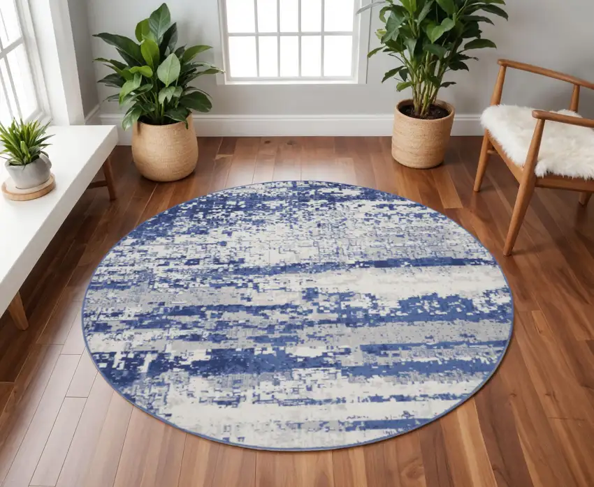8' Ivory and Navy Blue Abstract Round Rug Photo 1