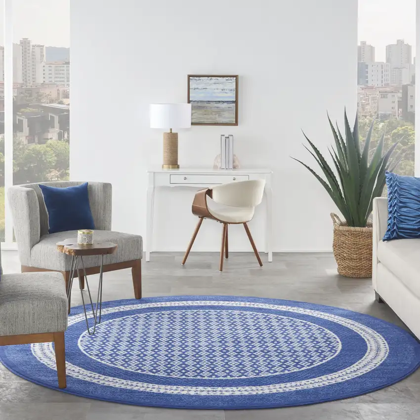 8' Ivory and Navy Blue Geometric Distressed Round Rug Photo 6