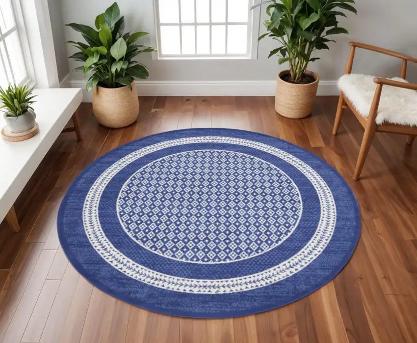 8' Ivory and Navy Blue Geometric Distressed Round Rug Photo 1