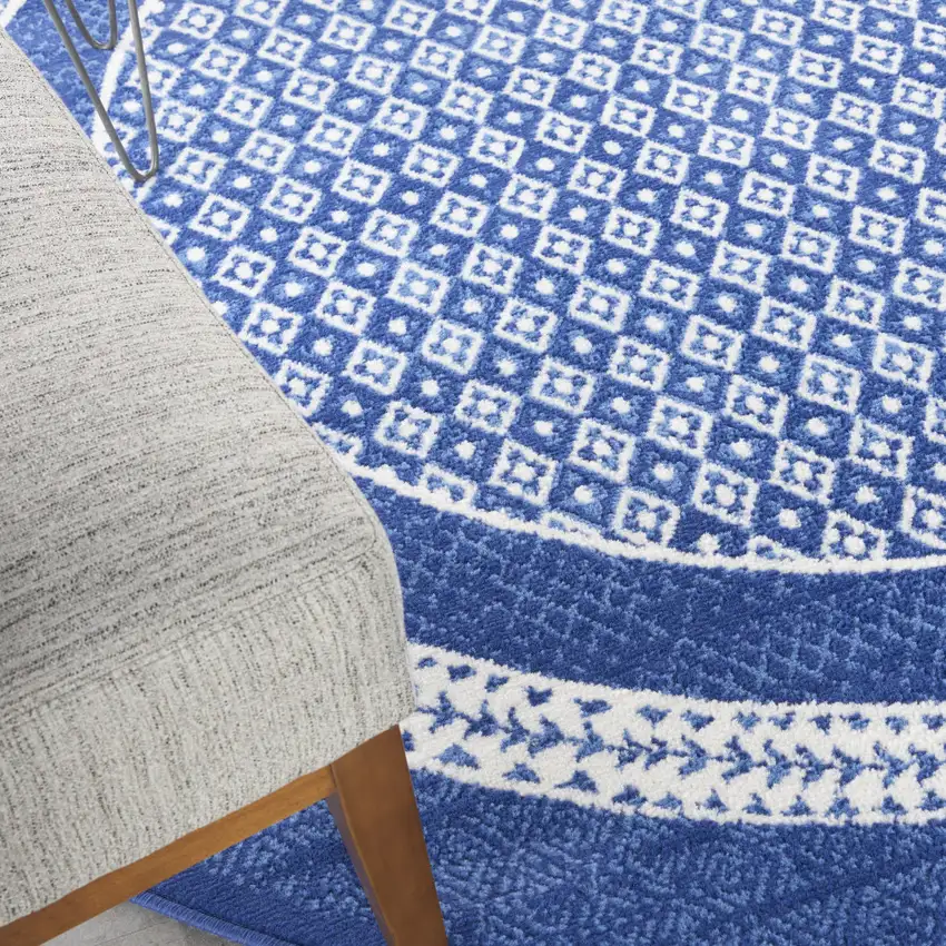 8' Ivory and Navy Blue Geometric Distressed Round Rug Photo 8