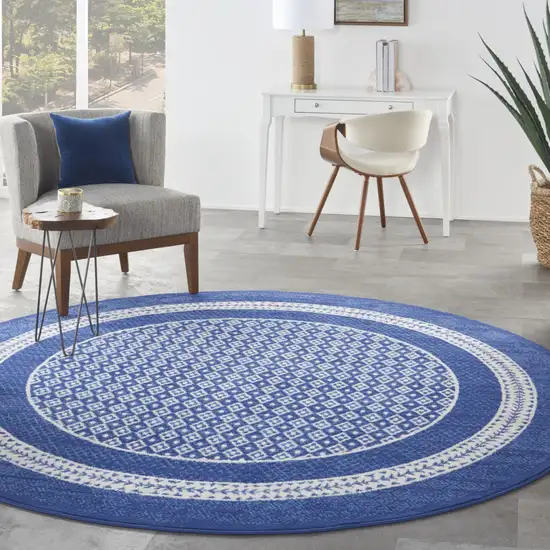 8' Ivory and Navy Blue Geometric Distressed Round Rug Photo 5