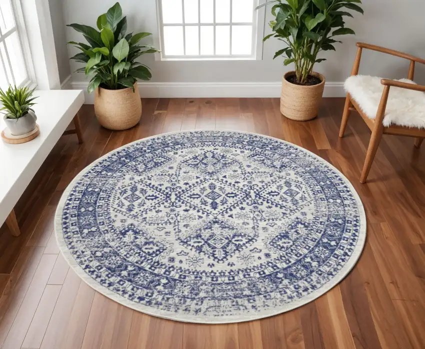 8' Ivory and Navy Blue Geometric Distressed Round Rug Photo 1