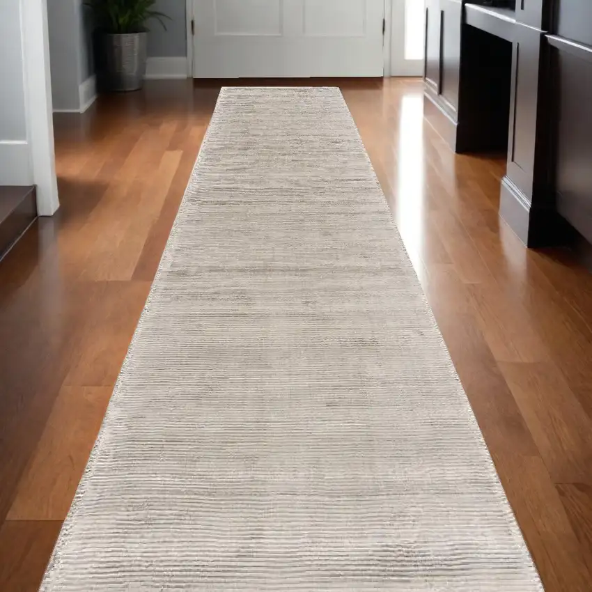 10' Ivory and Tan Hand Woven Runner Rug Photo 1