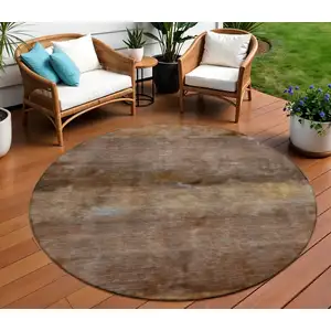 Photo of 8' Khaki And Brown Round Abstract Washable Indoor Outdoor Area Rug