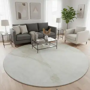 Photo of 8' Khaki And Ivory Geometric Washable Round Rug With UV Protection