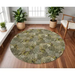 Photo of 8' Khaki Gray And Yellow Geometric Washable Round Rug With UV Protection