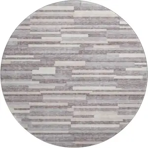 Photo of 8' Lavender And Ivory Striped Washable Round Rug With UV Protection