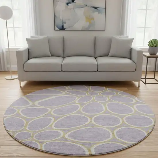 8' Lavender Gold And Ivory Geometric Washable Round Rug With UV Protection Photo 2