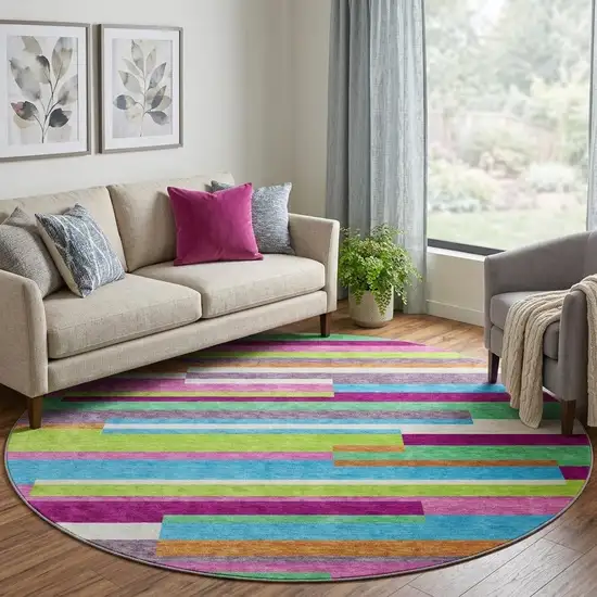 8' Lavender Orange And Lime Green Striped Washable Round Rug With UV Protection Photo 1