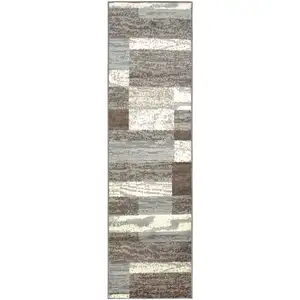 Photo of 8' Light Blue And Ivory Patchwork Power Loom Stain Resistant Runner Rug