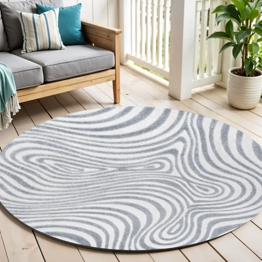 8' Light Blue And Ivory Round Abstract Indoor Outdoor Area Rug Photo 1