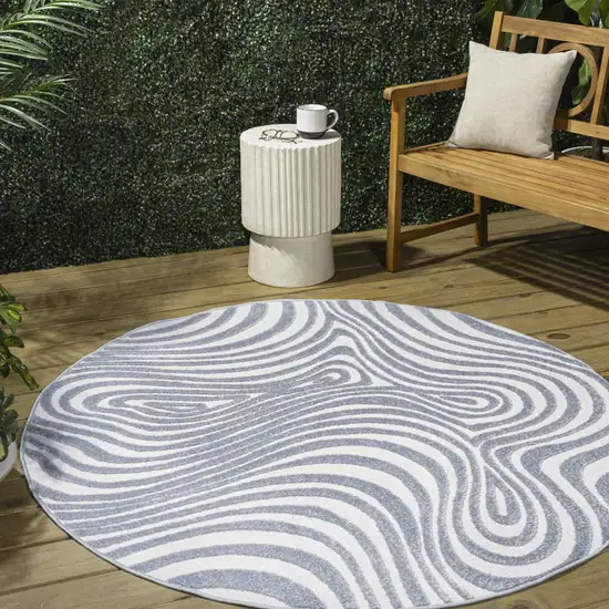 8' Light Blue And Ivory Round Abstract Indoor Outdoor Area Rug Photo 5