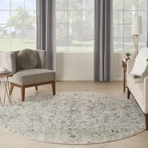 Photo of 8' Light Gray Black And Yellow Floral Distressed Round Rug