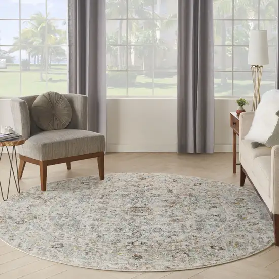 8' Light Gray Black And Yellow Floral Distressed Round Rug Photo 6
