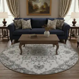 Photo of 8' Light Gray Ivory And Gold Floral Medallion Washable Round Rug With UV Protection
