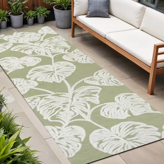 8' Light Green And Ivory Floral Indoor Outdoor Runner Rug Photo 1