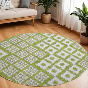 Photo of 8' Lime Green And Ivory Geometric Washable Round Rug With UV Protection