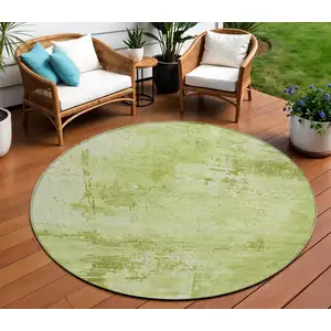 Photo of 8' Lime Green And Ivory Round Abstract Washable Indoor Outdoor Area Rug