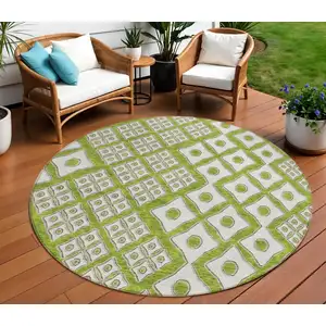 Photo of 8' Lime Green And Ivory Round Geometric Washable Indoor Outdoor Area Rug