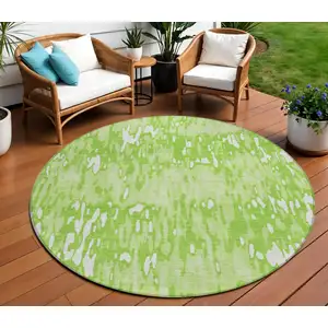 Photo of 8' Lime Green And Ivory Round Striped Washable Indoor Outdoor Area Rug