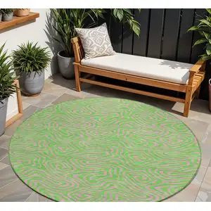 Photo of 8' Lime Green And Pink Round Abstract Washable Indoor Outdoor Area Rug