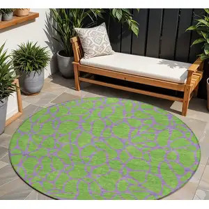 Photo of 8' Lime Green And Purple Round Geometric Washable Indoor Outdoor Area Rug