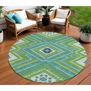 Photo of 8' Lime Green Aqua And Ivory Round Tribal Washable Indoor Outdoor Area Rug