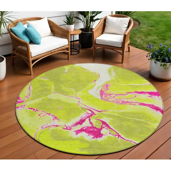 8' Lime Green Neon Pink And Ivory Round Abstract Washable Indoor Outdoor Area Rug Photo 1