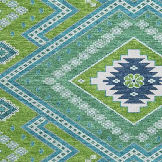 8' Lime Green Teal And Ivory Tribal Washable Round Rug With UV Protection Photo 3