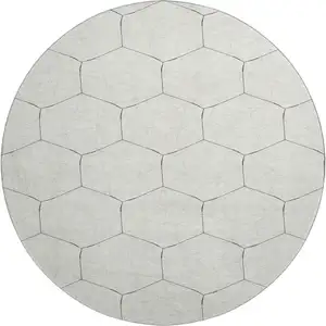 Photo of 8' Linen And Black Geometric Washable Round Rug With UV Protection
