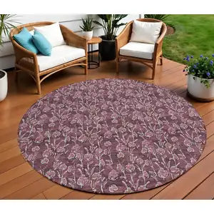 Photo of 8' Merlot Mauve And Ivory Round Floral Washable Indoor Outdoor Area Rug