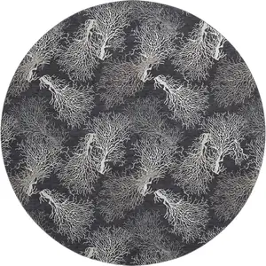 Photo of 8' Midnight And White Geometric Washable Round Rug With UV Protection