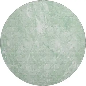 Photo of 8' Mint Green And Ivory Abstract Washable Round Rug With UV Protection