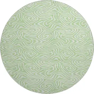 Photo of 8' Mint Green And Ivory Abstract Washable Round Rug With UV Protection